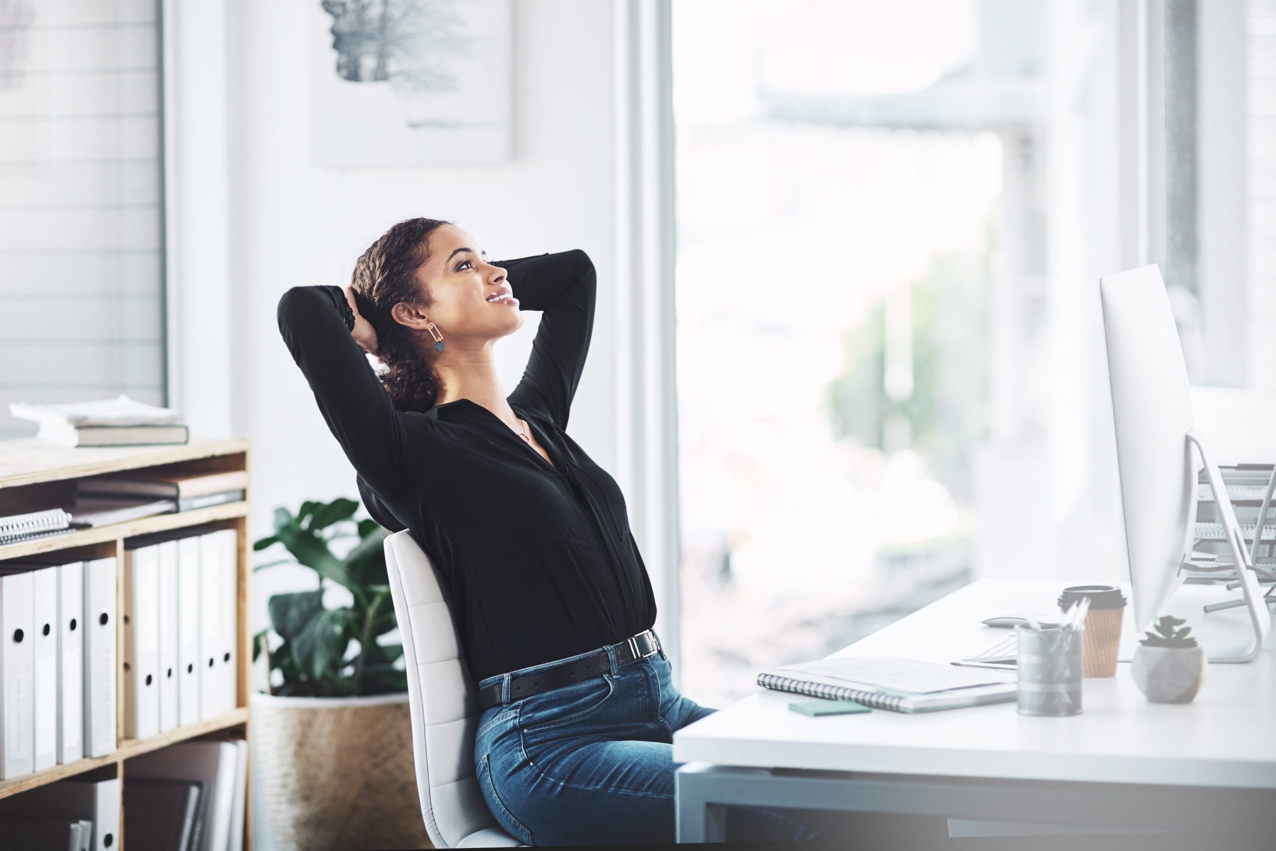 Woman stretching at desk