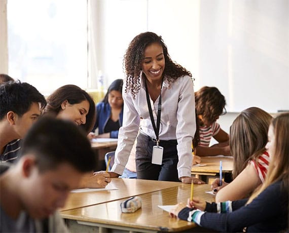 Teacher Working With Group of Students